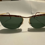 Vintage Vogue sunglasses with gold metal frame and green lenses
