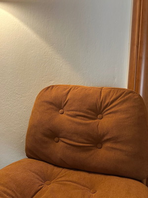 Modern swivel armchair, terracotta fabric and metal