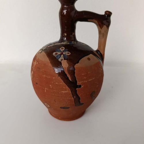 Clay jug with handmade painting used