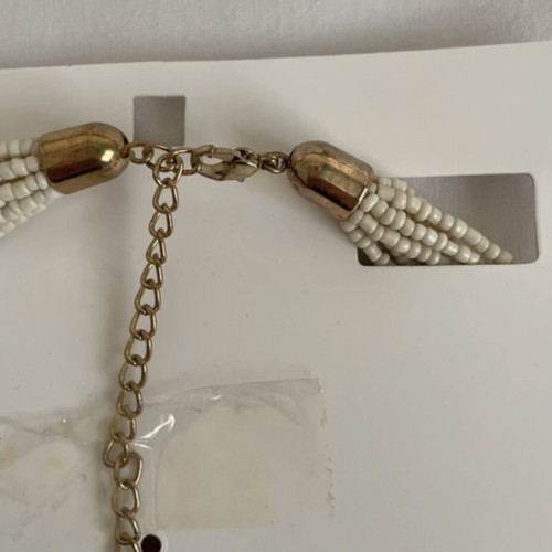 Wide necklace like new with beige and gold beads and metal details
