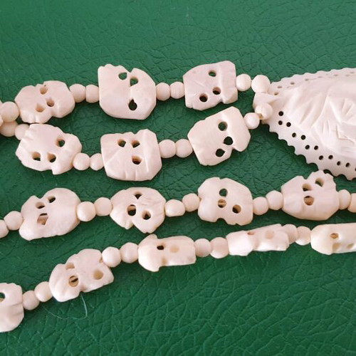 Carved vintage bone necklace with elephant pendant
