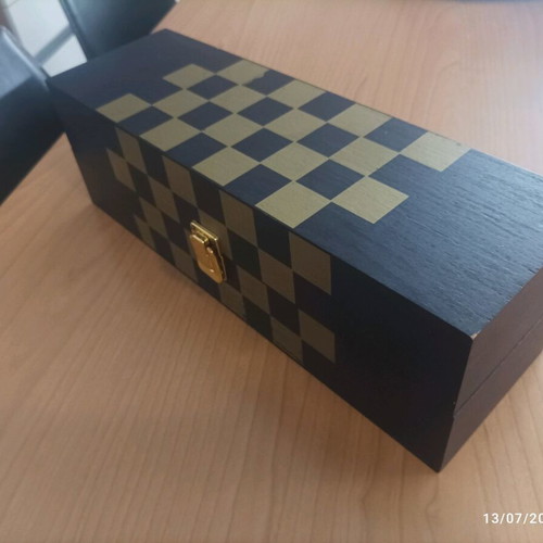 Wooden wine case used with travel chess set