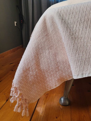 Set of two used salmon-colored throws with fringes