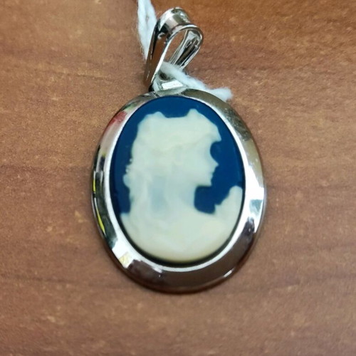 Cameo new with blue background and carved young woman figure