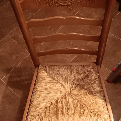 Wooden chair used with cane seat and embossed wood