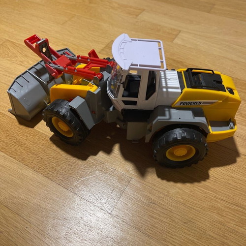 Toy excavator in like-new condition
