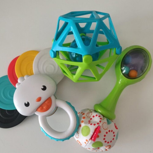 Gabesy ergonomic hip seat carrier used with branded baby toys