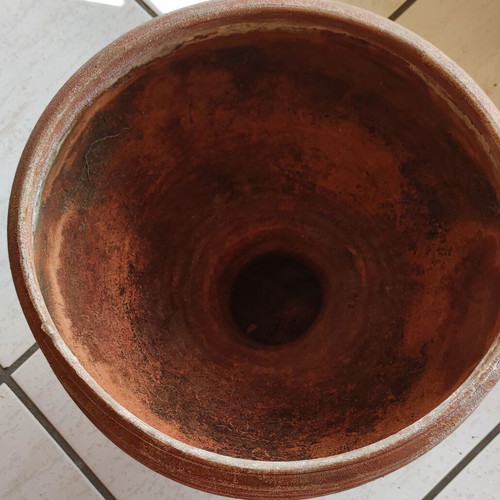Clay flowerpot used with crack at base