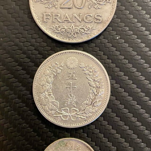 Silver coins used: 20 francs Tunisie 1935, 50 Sen Meiji 1898, 2 Jiao China 1932