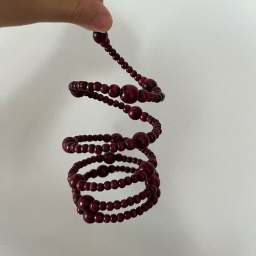 Wooden spiral bracelet like new with adjustable diameter and brown-red beads