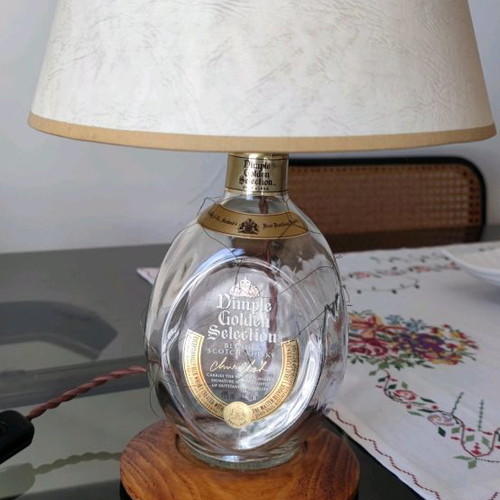 Dimple Golden Selection lamp used with handmade papyrus shade and wooden base