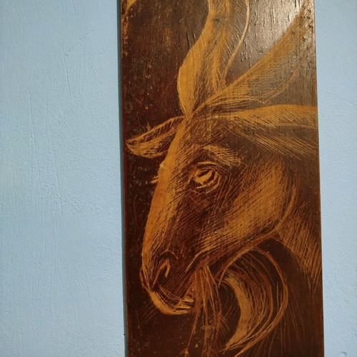 Woodcut goat head design on old wood new