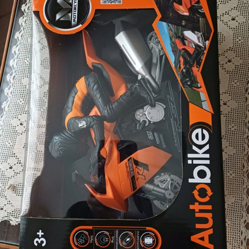 Toy motorcycle vehicle with rider, sounds, lights, and bump & go function new