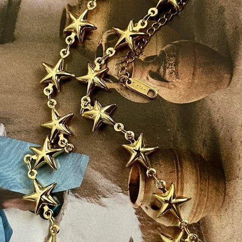 Steel necklace with gold stars, new