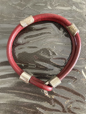 Leather cord bracelet with silver-tone metal accents