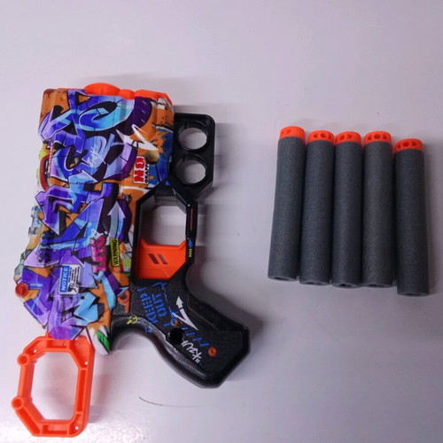 X-Shot Skins Menace toy gun used with 5 darts, graffiti design