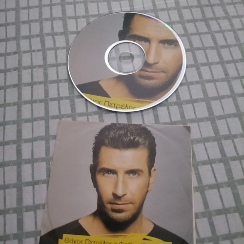 CD Eftihos! by Thanos Petrelis used, music by Foivos