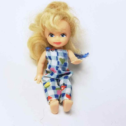 Plastic doll used with torn clothes