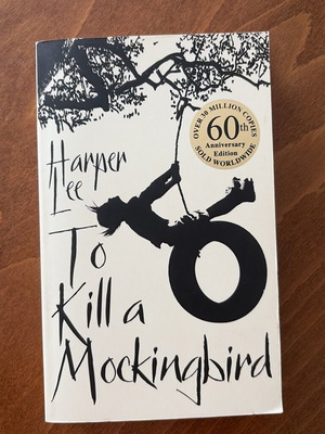 To Kill a Mockingbird by Harper Lee used, okay condition with slight spine damage