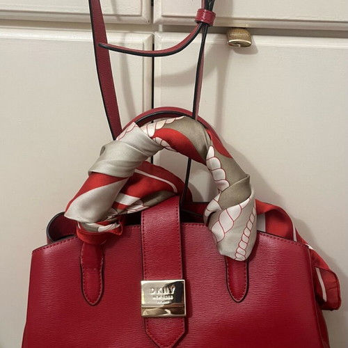 DKNY red leather handbag new with tags and protective case