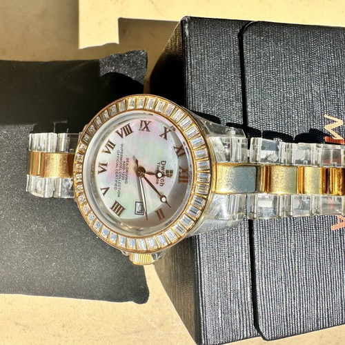 Watch with iridescent crystals like new, zircon and gold