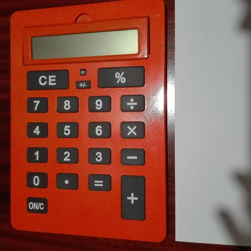 Giant calculator used, orange, A4 size