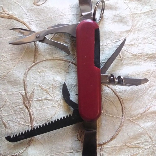Multitool pocket knife like new, stainless steel with saw and scissors