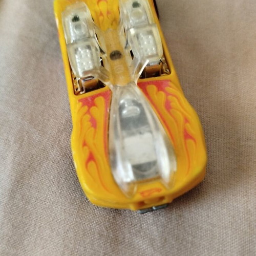 Hot Wheels metal toy car like new, yellow with orange flames by Mattel