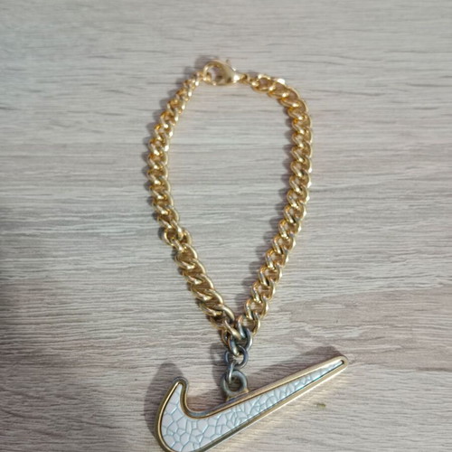 Nike decorative pendant with chain used, gold tone