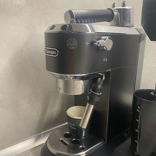 Delonghi Nespresso machine used with coffee bean grinder gift