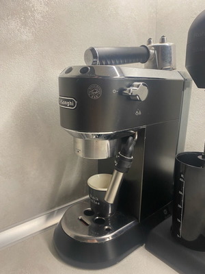 Delonghi Nespresso machine used with coffee bean grinder gift