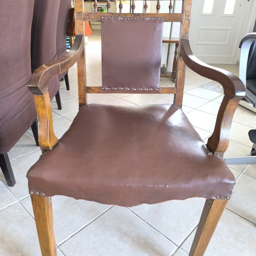 Vintage armchair refurbished with carved wood and leather backrest