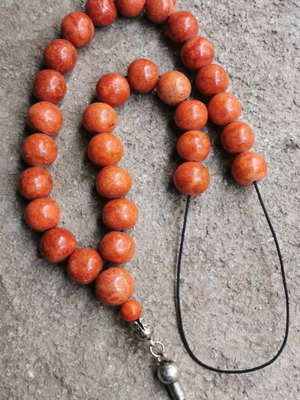 Handmade worry beads with red coral beads used