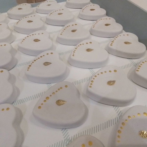 Wedding favors scented plaster hearts in organza pouch with glass bottles
