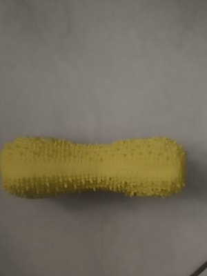 Yellow plastic dog toy with squeaker
