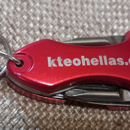 Mini multitool keychain KTEO used with flashlight