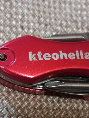 Mini multitool keychain KTEO used with flashlight