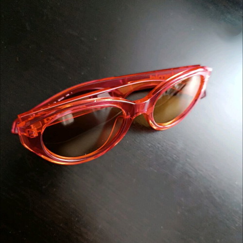Polaroid PLD 6051/G/S sunglasses like new, transparent red with orange lens