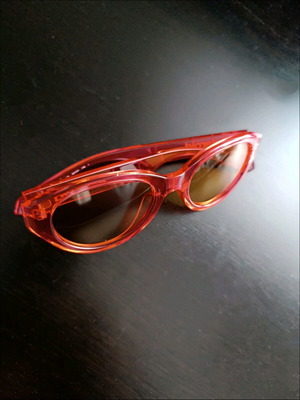 Polaroid PLD 6051/G/S sunglasses like new, transparent red with orange lens