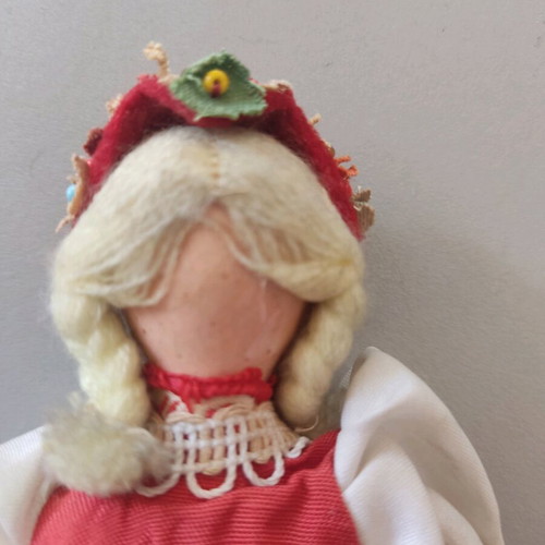 Vintage doll used with porcelain head and embroidered apron