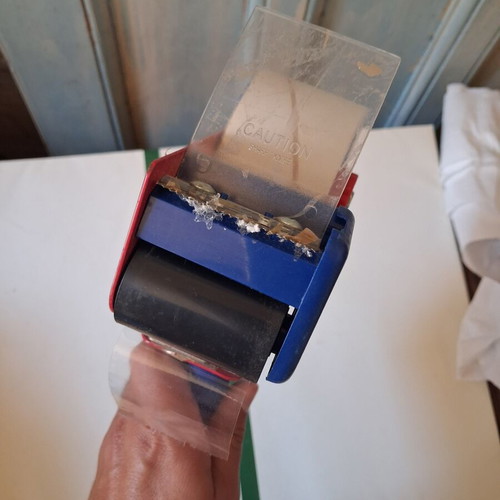 Packing tape gun used with roll included