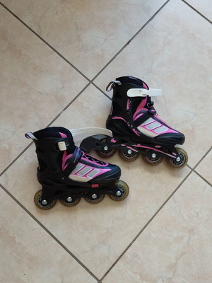 Rollers adjustable size 33-36, like new, black/fuchsia