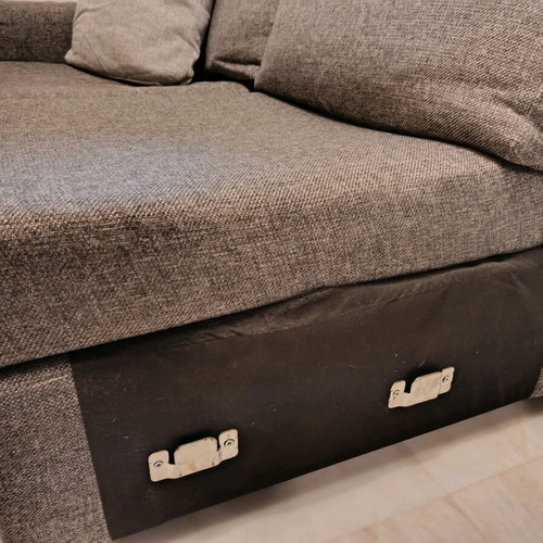 Three-seater sofa used in gray color with two cushions