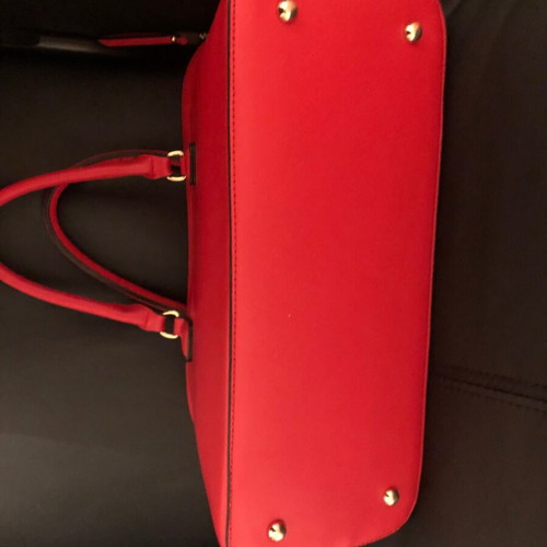 Red handbag used with wear marks