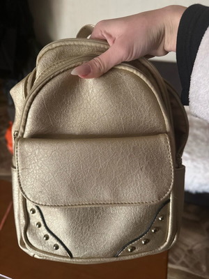 Backpack like new, gold color