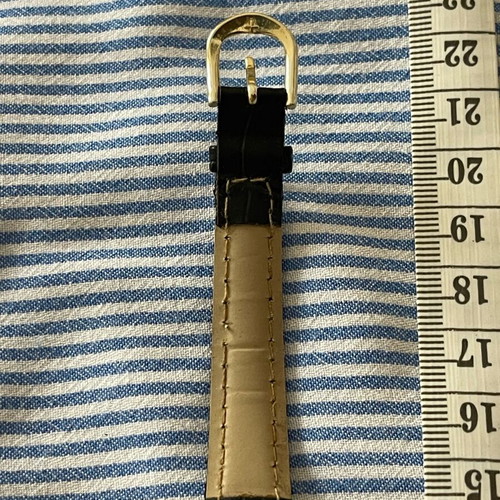 Citron wristwatch used with gold color and black strap