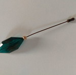 Pin with large green crystal