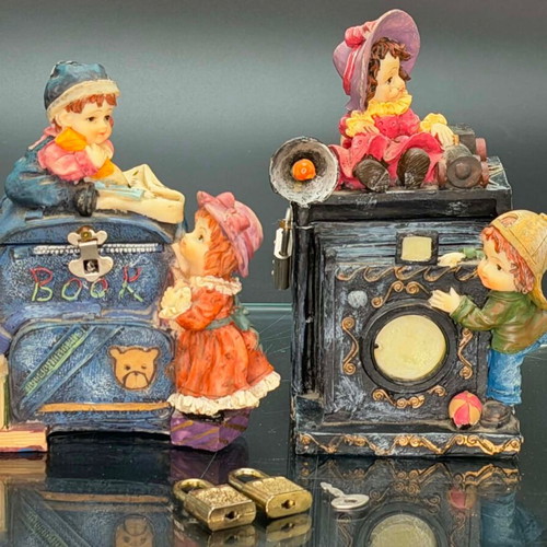 Vintage polyresin piggy banks with three locks and working key