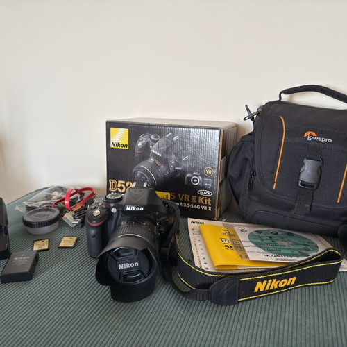 Nikon D5200 DSLR with AF-S DX 18-55mm VR II lens, like new