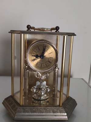 Vintage anniversary table clock with rotating pendulum (80s-90s)